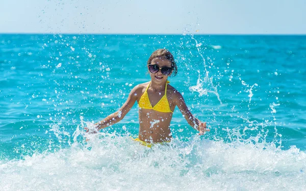 Child Splashes Water Sea Selective Focus People — Stockfoto