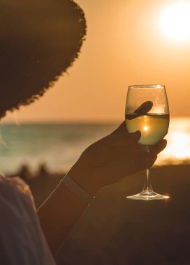 Wine glasses at sunset on the beach. Selective focus. Nature.