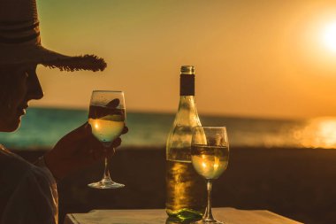Wine glasses at sunset on the beach. Selective focus. Nature.