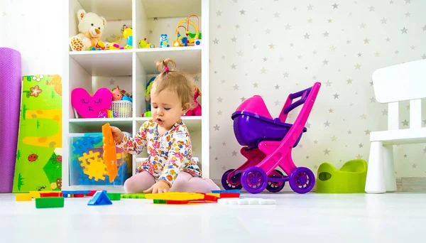 Child Plays Toys Room Selective Focus Baby — Stock Photo, Image