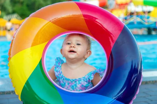 Baby with a circle near the pool. Selective focus. — Stock Photo, Image