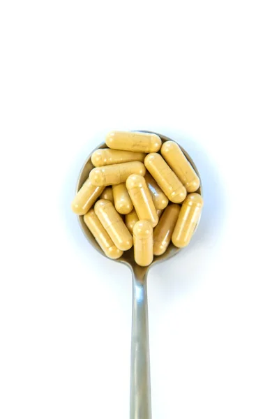 Χάπια Ένα Κουτάλι Απομονώνονται Λευκό Φόντο Επιλεκτική Εστίαση Ιατρική — Φωτογραφία Αρχείου