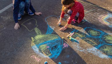 Children draw the flag of Ukraine. Selective focus.