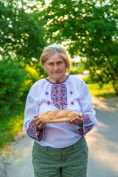 Grandmother Ukrainian Bread Her Hands Selective Focus Food — Stock Photo, Image