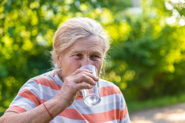 Grandmother Drinks Water Glass Selective Focus Drink — Stockfoto