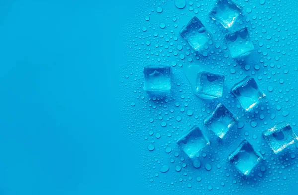 Ice cubes on a blue background. Selective focus. Food.