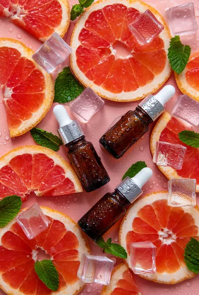 Grapefruit essential oil in a bottle. Selective focus. Spa.