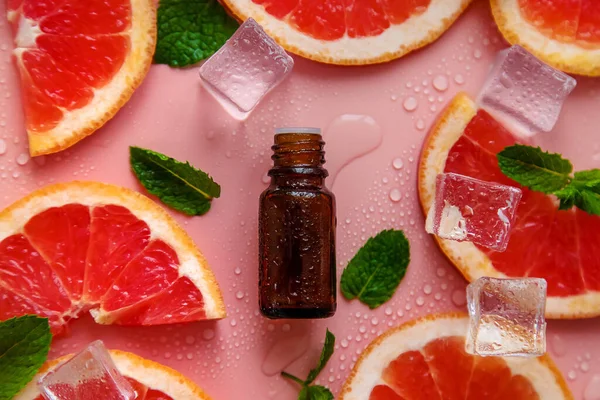 Grapefruit essential oil in a bottle. Selective focus. Spa.