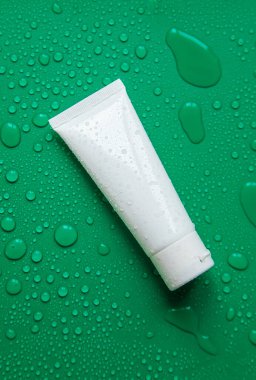 Cosmetics with moisturizing on a wet background. Selective focus. Spa.