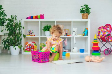 Children sit on the potty in the room. Selective focus. Kid.