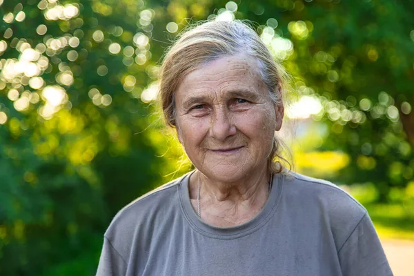 grandmother portrait of an old woman. Selective focus. People.