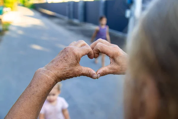 Grandmother Makes Heart Her Hands Selective Focus People — Stockfoto