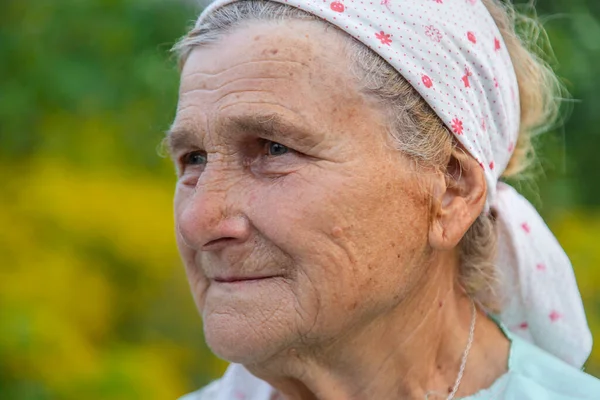 Beautiful portrait of an old woman. Selective focus. People.