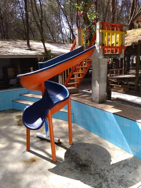 Slide Children Dry Abandoned Former Swimming Pool — Stock Photo, Image