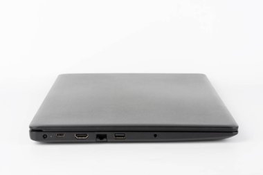 Modern, new office  black  laptop  on white background, side view. USB 2.0 port, RJ-45, HDMI port. 