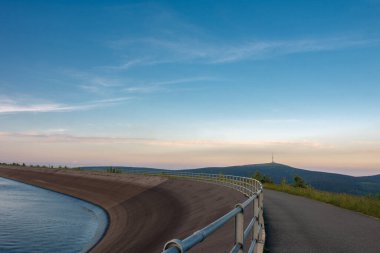Upper water reservoir of the pumped storage hydro power plant Dlouhe Strane in Jeseniky Mountains, Czech Republic. Top of the Praded mountain behind the lake.