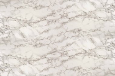 Ceramic tile texture - close-up of beige ceramic tile with marble structure