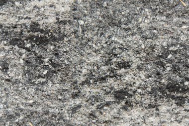 Taş duvarın dokusu - Gri grafit taş bloklardan yapılmış bir çitin bir parçasının yakın çekimi