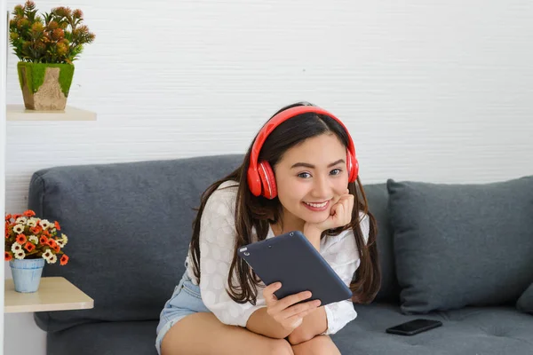 Young Asian Woman Wear Red Headphones Relaxing Listening Music While — Stock Photo, Image