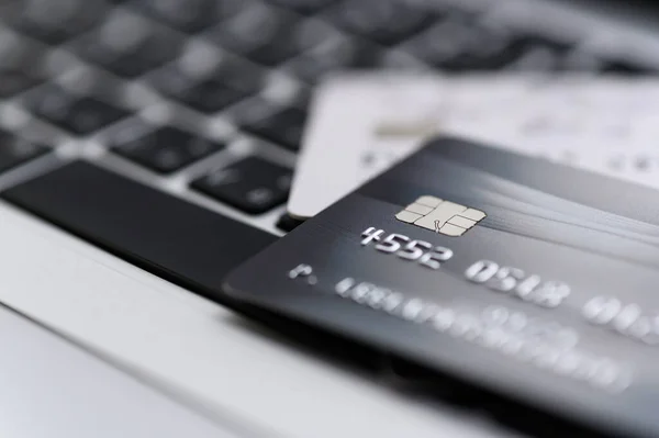 Close up shot of credit card on Laptop computer payment for purchases from online stores and online shopping. Concept of internet purchase. Selective focus for background