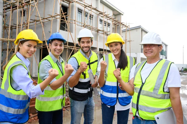 Group Contractors Engineers Formats Safety Vests Helmets Hands Work Together — Zdjęcie stockowe