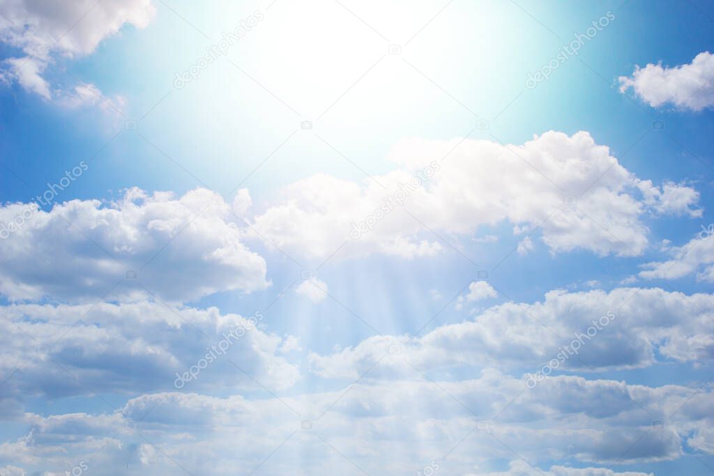 Blue sky with rays. Beautiful cloudy sky