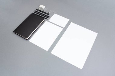 Business background. notebook and templates of different formats on a gray background.