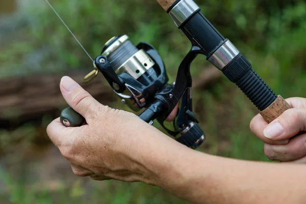 Close Woman Hand Fishing Rod Stock Image