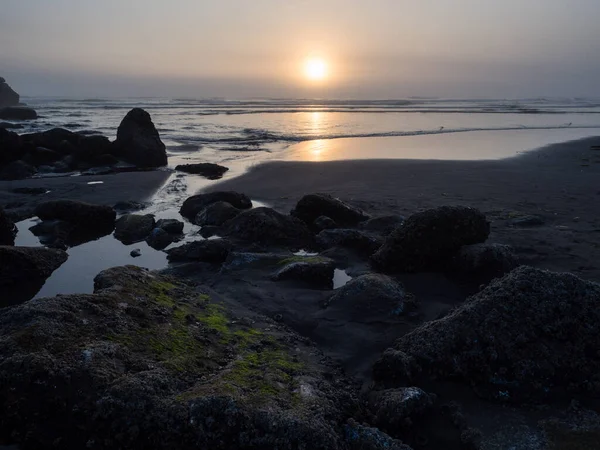 Tidal pools at sunset on the North Jetty beach - Ocean Shores, WA, USA