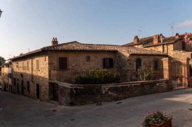 A quiet street of residential buildings in the historic medieval village of Panzano near Greve in Chianti in Florence province, Tuscany, Italy . High quality photo