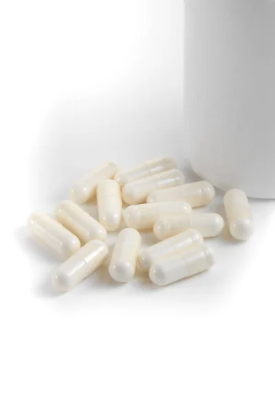 Close Couple White Pills Capsules Isolated White Background Selective Focus — Stock Photo, Image