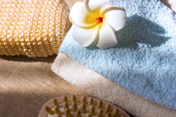 Cotton towel natural organic washcloth and wooden massage brush close-up, body care spa treatments bathroom accessories