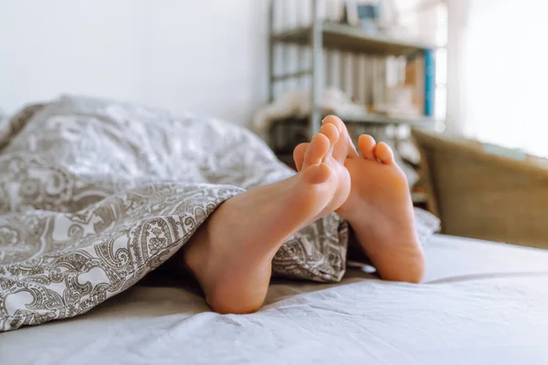 Legs Young Woman Peek Out Covers Lying Bed Warm Blanket — Stock Photo, Image