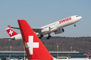 Zurich, Switzerland, February 10, 2022 Swiss International Airlines Airbus A330-343 aircraft taking off from runway 16 at the international airport clipart