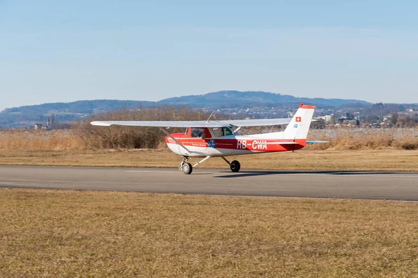 Wangen-Lachen, Switzerland, February 13, 2022 Cessna 150L Aerobat in take off position on a small airfield