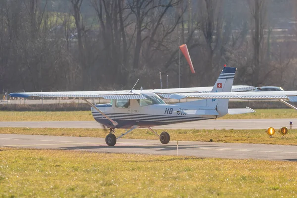 Saint Gallen, Altenrhein, Switzerland, February 12, 2022 Cessna 152 propeller plane on the taxiway at the airport