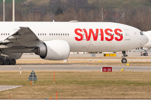 Zurich, Switzerland, February 24, 2022 Swiss International Airlines Boeing 777-300ER is taxiing to its gate