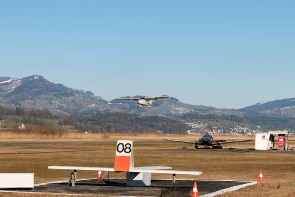 Wangen-Lachen, Switzerland, February 27, 2022 Cessna 152 propeller plane is taking off from a small airfield