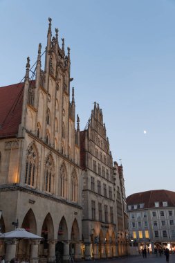 Muenster, Germany, July 8, 2022 Historic city hall in the old town in the late evening