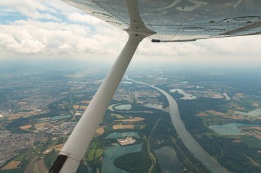 Karlsruhe, Germany, July 9, 2022 Flight abeam the city center in a small plane