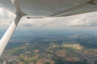 Karlsruhe, Germany, July 9, 2022 Flight abeam the city center in a small plane