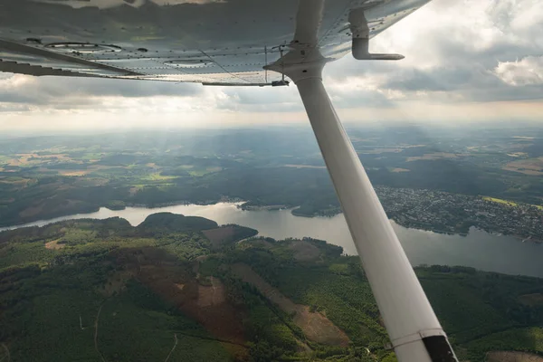 Sundern, North rhine Westphalia, Germany, July 8, 2022 Flight overhead the lake Sorpesee with a small plane