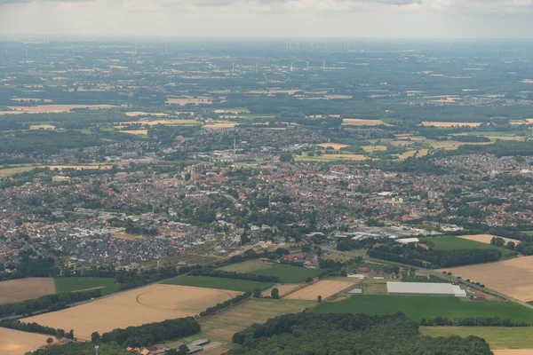 Greven, Northrhine Westphalia, Germany, July 9, 2022 View over the city from a small plane