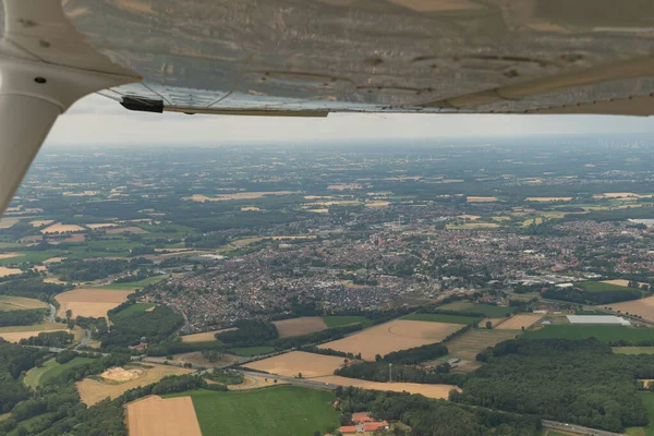 Greven, Northrhine Westphalia, Germany, July 9, 2022 View over the city from a small plane