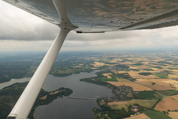 Koerbecke, Germany, July 9, 2022 Flight overhead the lake Moehnesee with a small plane