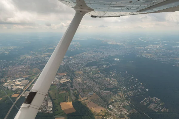 Karlsruhe, Germany, July 9, 2022 Flight abeam the city center in a small plane