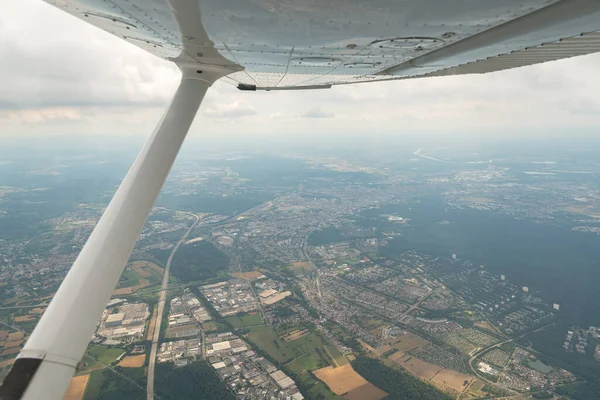 Karlsruhe, Germany, July 9, 2022 Flight abeam the city center in a small plane