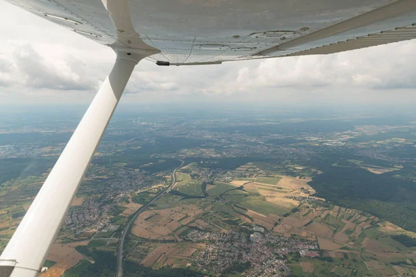 Karlsruhe, Germany, July 9, 2022 Flight abeam the city center in a small plane
