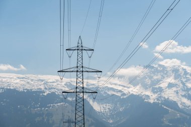 Balzers, Liechtenstein, April 28, 2022 High voltage electric pole in an alpine scenery