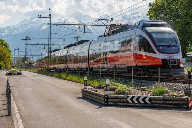 Nendeln, Liechtenstein, April 28, 2022 Local rain from Austria is waiting at the platform from a little station